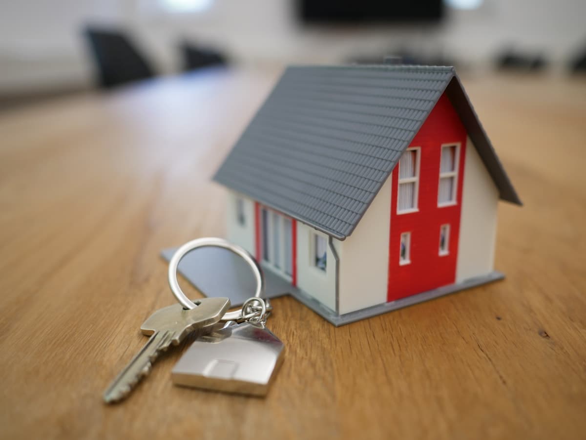 House keys on a table — deciding whether to rent or sell a Charlotte home