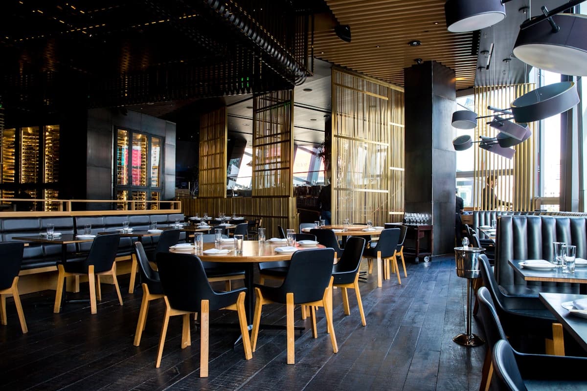 Upscale restaurant dining room with warm lighting