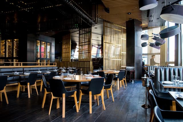 Upscale restaurant dining room with warm lighting